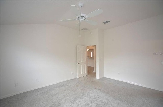 carpeted empty room with lofted ceiling and ceiling fan