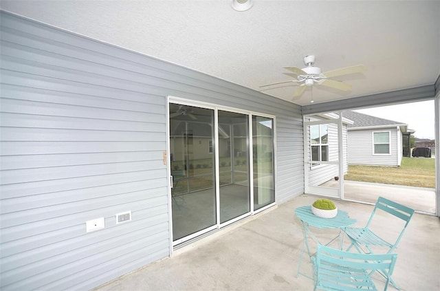 view of patio / terrace featuring ceiling fan