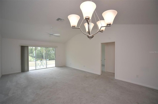 spare room with carpet flooring, lofted ceiling, and a notable chandelier