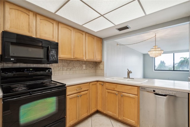 kitchen featuring sink, backsplash, a chandelier, light tile patterned flooring, and black appliances