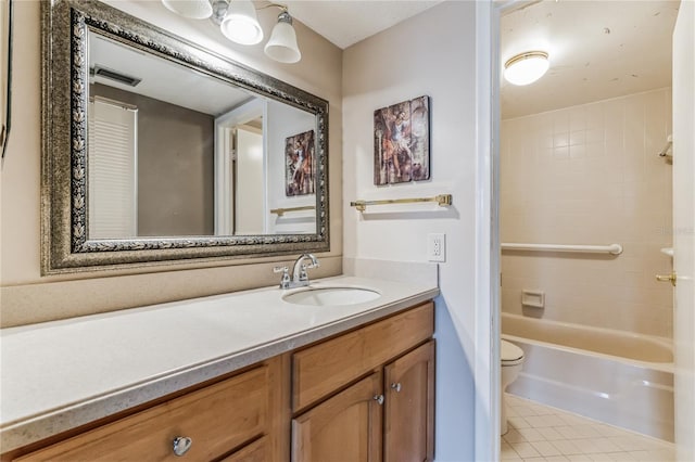 full bathroom featuring tile patterned flooring, vanity, toilet, and tiled shower / bath combo