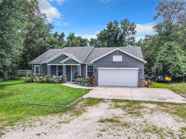 craftsman inspired home with a garage and a front yard