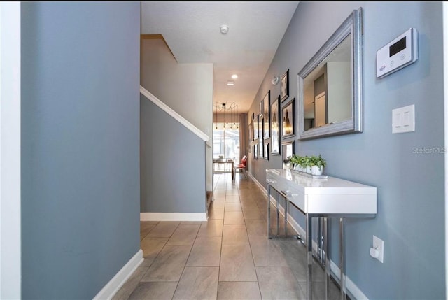 hallway with tile patterned floors