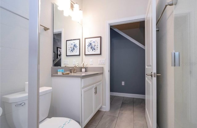 bathroom featuring vanity, toilet, and tile patterned floors