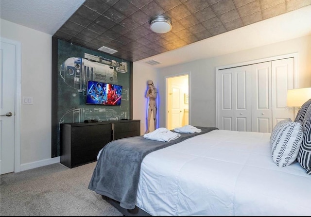 bedroom featuring a closet and carpet floors