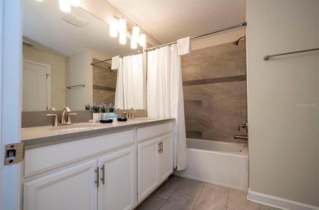 bathroom featuring shower / bathtub combination with curtain, vanity, tile patterned flooring, and a textured ceiling