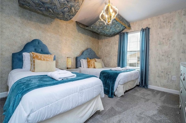 bedroom featuring carpet flooring and an inviting chandelier