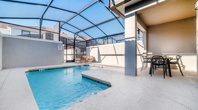 view of pool with a lanai and a patio area