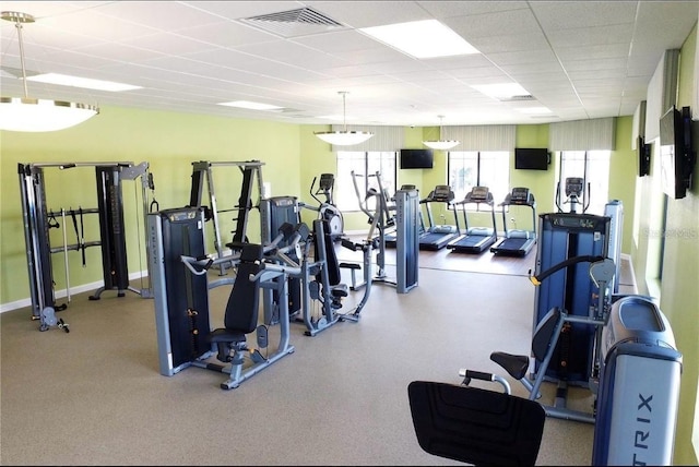 gym featuring a drop ceiling