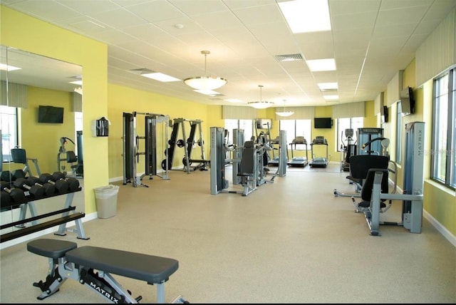 exercise room featuring a paneled ceiling