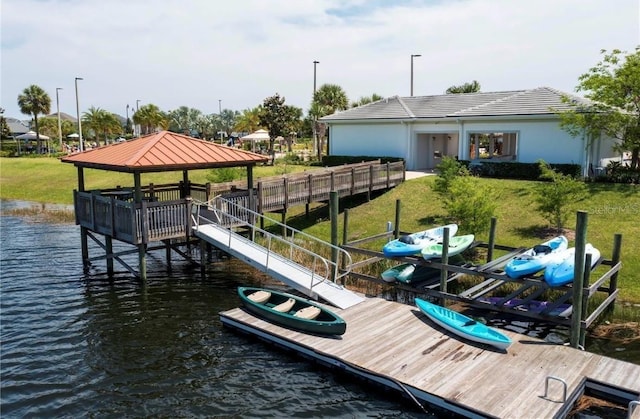 dock area with a gazebo and a water view