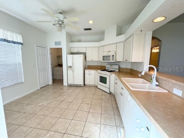 kitchen featuring sink, white appliances, ceiling fan, and white cabinetry