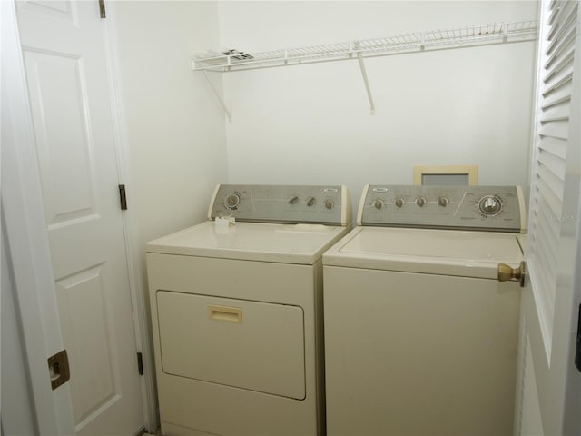 washroom with washer and dryer