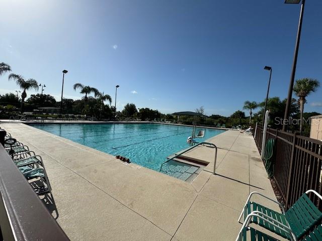 view of swimming pool with a patio area