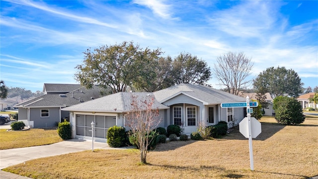 ranch-style house with a garage, driveway, and a front lawn