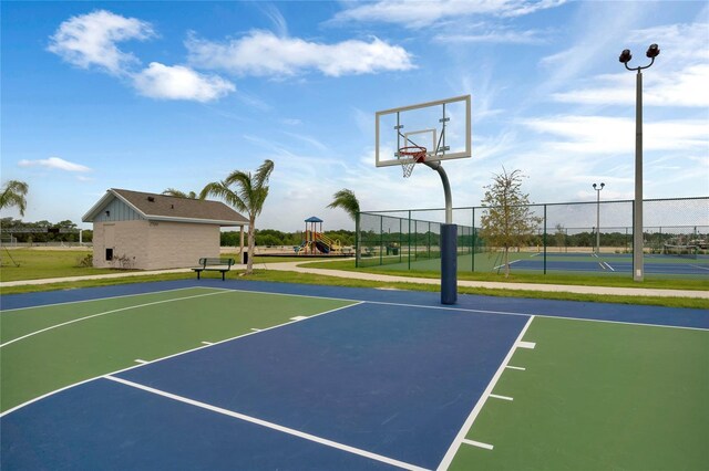 view of sport court featuring a playground and a lawn