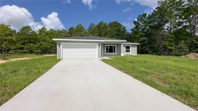 ranch-style house with a garage and a front lawn