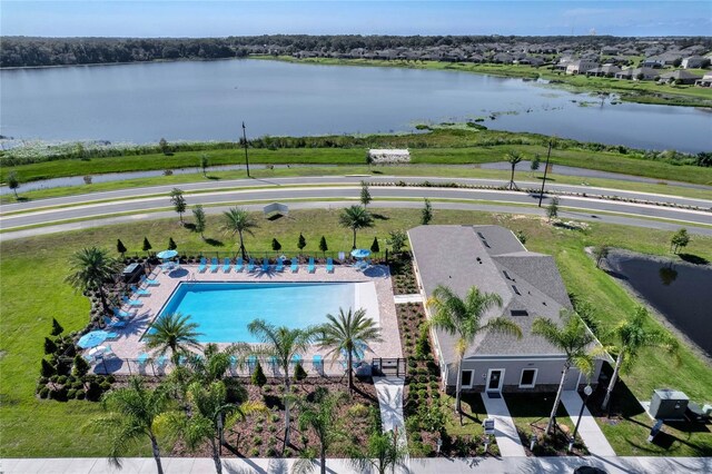 birds eye view of property with a water view