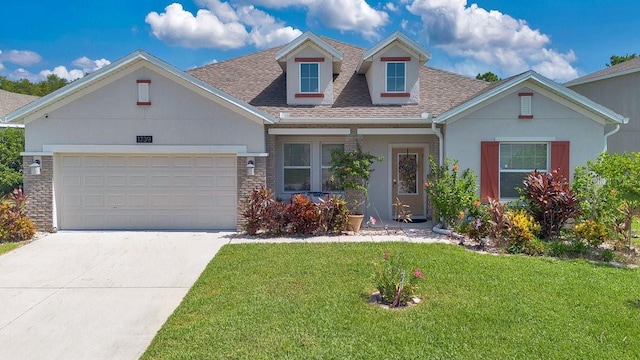 view of front facade featuring a garage and a front yard