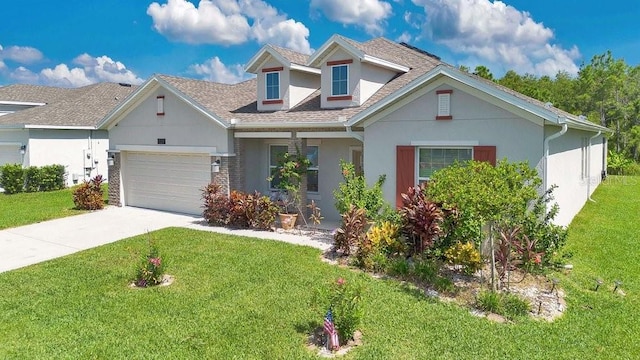 view of front of property featuring a garage and a front lawn