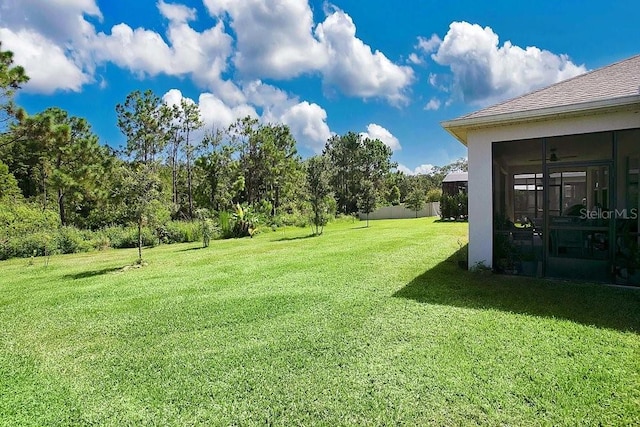 view of yard featuring a sunroom