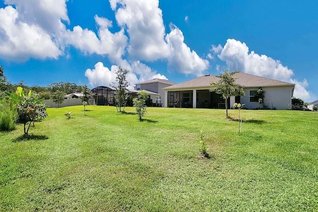 view of yard with a lanai