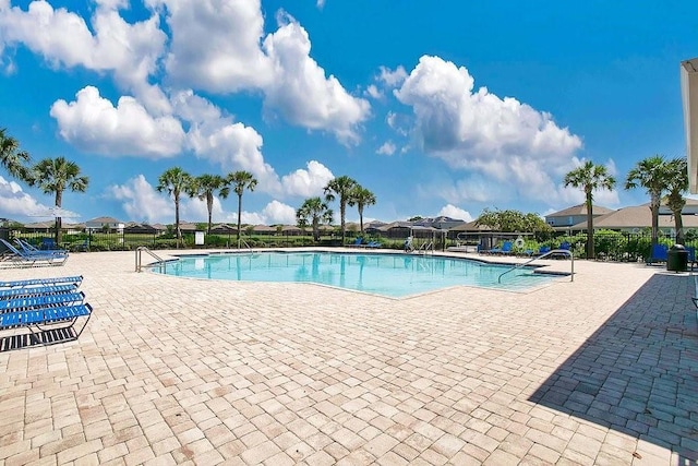 view of swimming pool featuring a patio