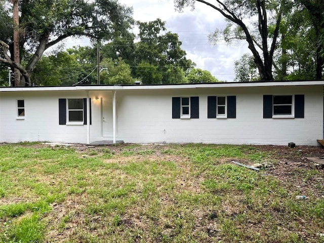 ranch-style house with a front lawn