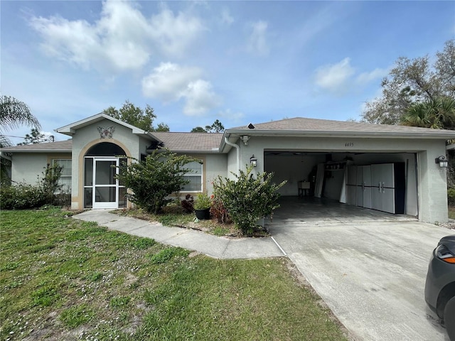 ranch-style home with a garage and a front lawn