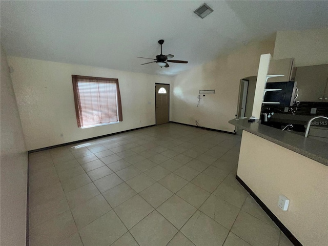 kitchen featuring light tile patterned floors and ceiling fan