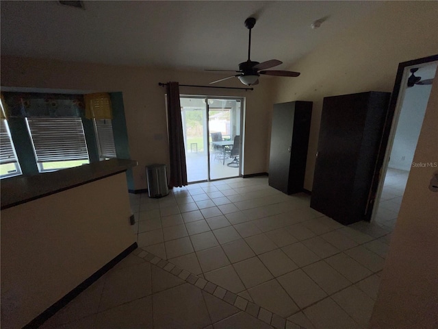 tiled spare room featuring ceiling fan