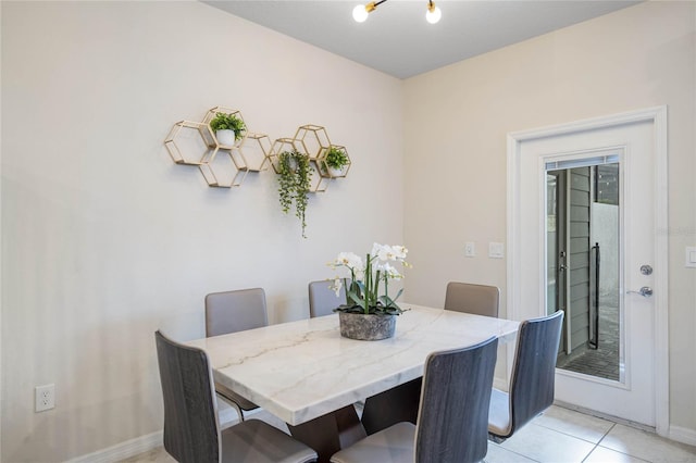 dining area featuring light tile patterned floors