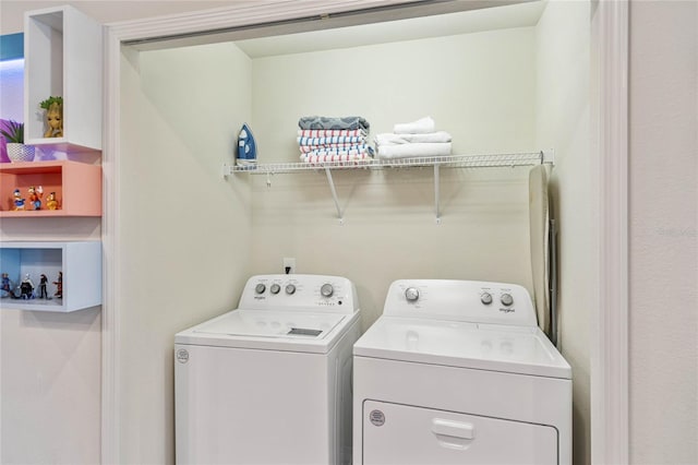 washroom featuring washer and dryer