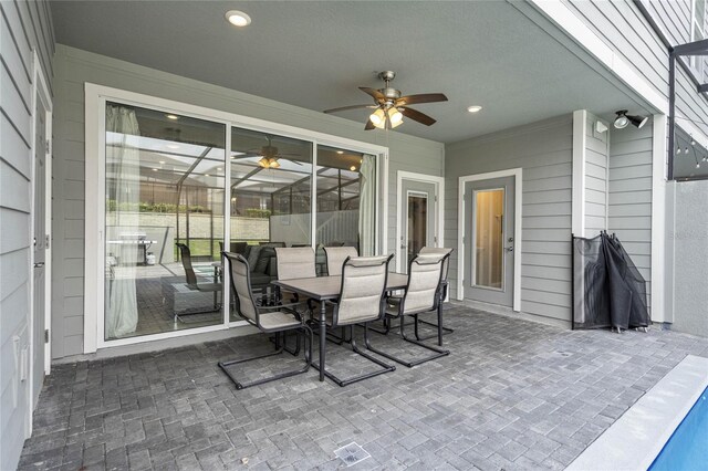 view of patio featuring ceiling fan