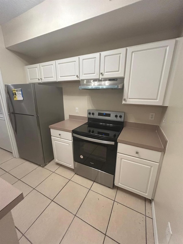 5578 Metrowest Blvd Unit 107, Orlando, FL 32811 - kitchen with appliances with stainless steel finishes, under cabinet range hood, and white cabinetry