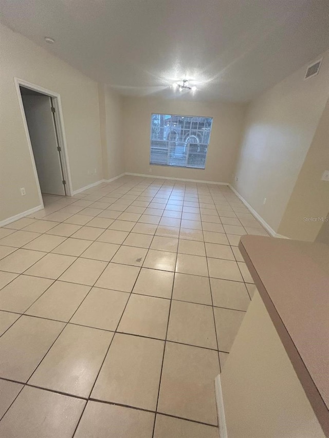 5578 Metrowest Blvd Unit 107, Orlando, FL 32811 - spare room with light tile patterned floors and baseboards