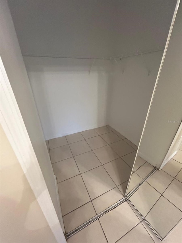 5578 Metrowest Blvd Unit 107, Orlando, FL 32811 - spacious closet featuring light tile patterned floors