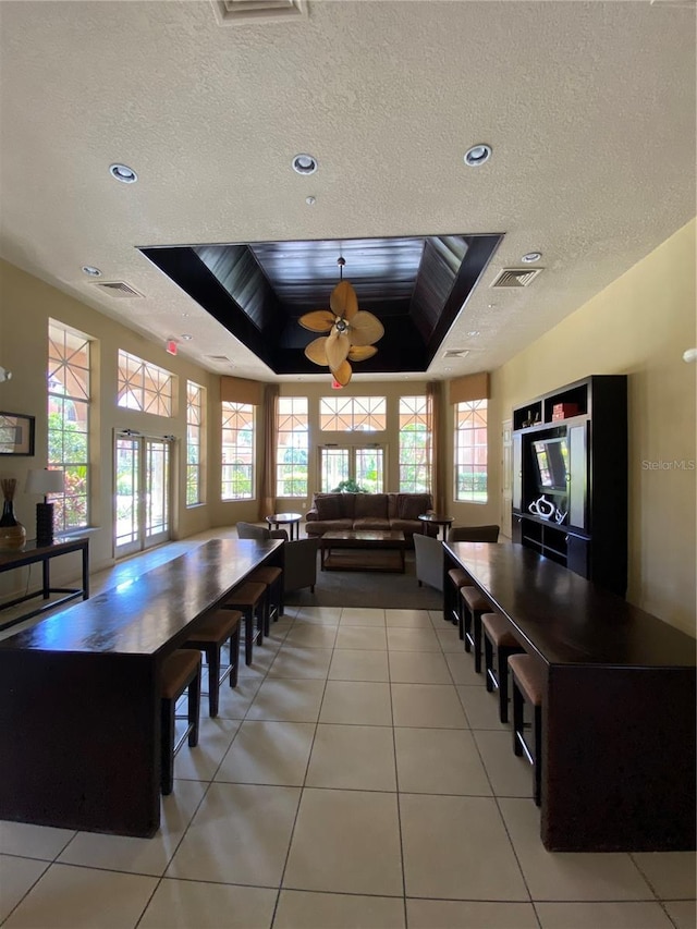 5578 Metrowest Blvd Unit 107, Orlando, FL 32811 - dining room with plenty of natural light, a textured ceiling, light tile patterned floors, and recessed lighting