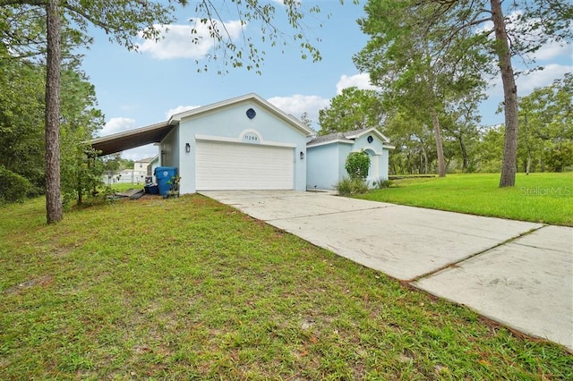 view of front of house featuring a front yard, a garage, and a carport