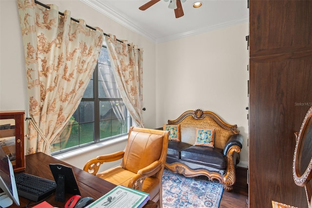 sitting room with ornamental molding, wood-type flooring, and ceiling fan