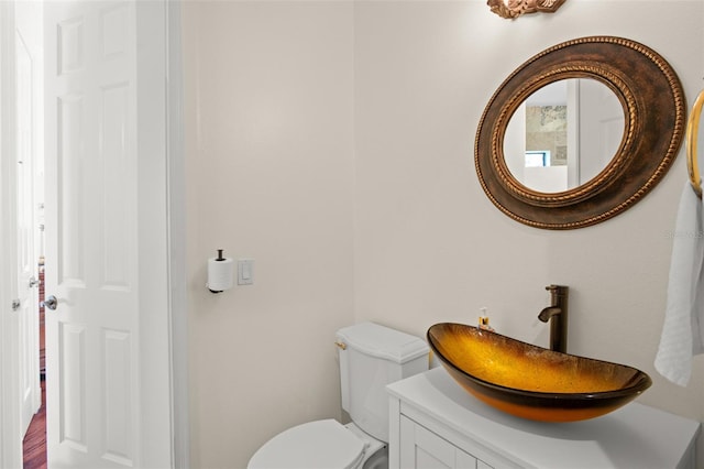 bathroom with vanity and toilet