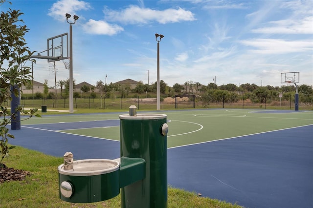 view of sport court featuring community basketball court and fence