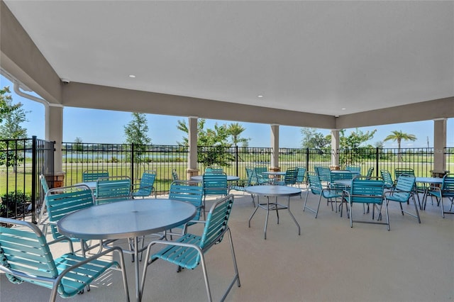 view of patio featuring fence and outdoor dining space