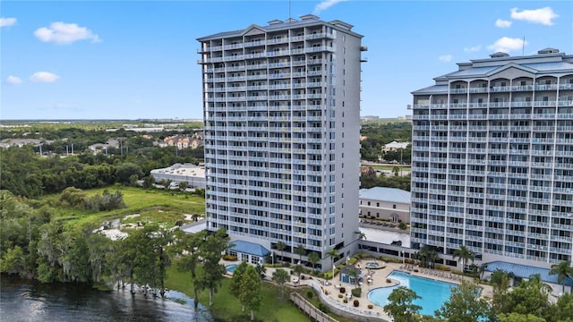 view of building exterior featuring a community pool