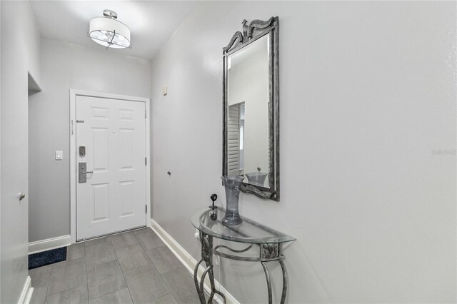 13427 Blue Heron Beach Dr Unit 405, Orlando, FL 32821 - doorway to outside with baseboards