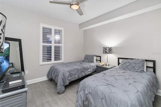 bedroom featuring ceiling fan and wood-type flooring