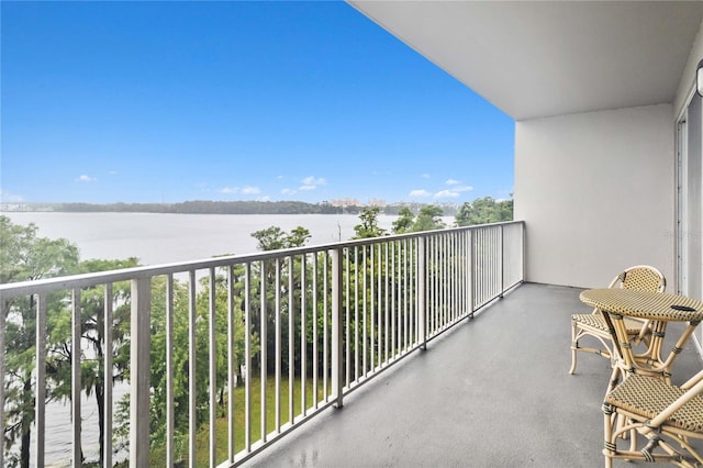 balcony featuring a water view