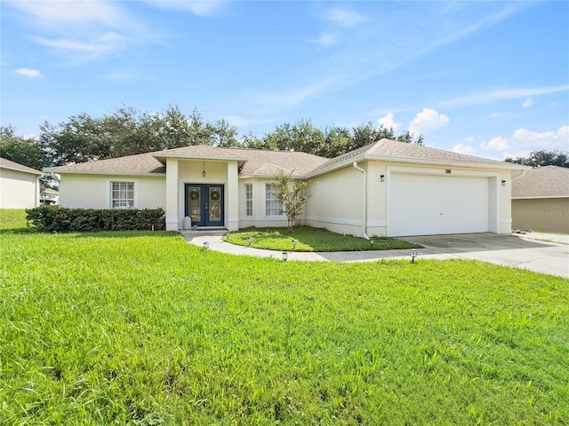 view of front of house featuring a garage and a front lawn