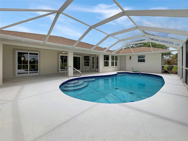 view of pool featuring a lanai and a patio area