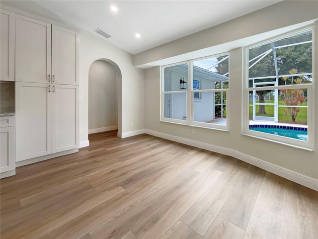 unfurnished dining area featuring light hardwood / wood-style floors